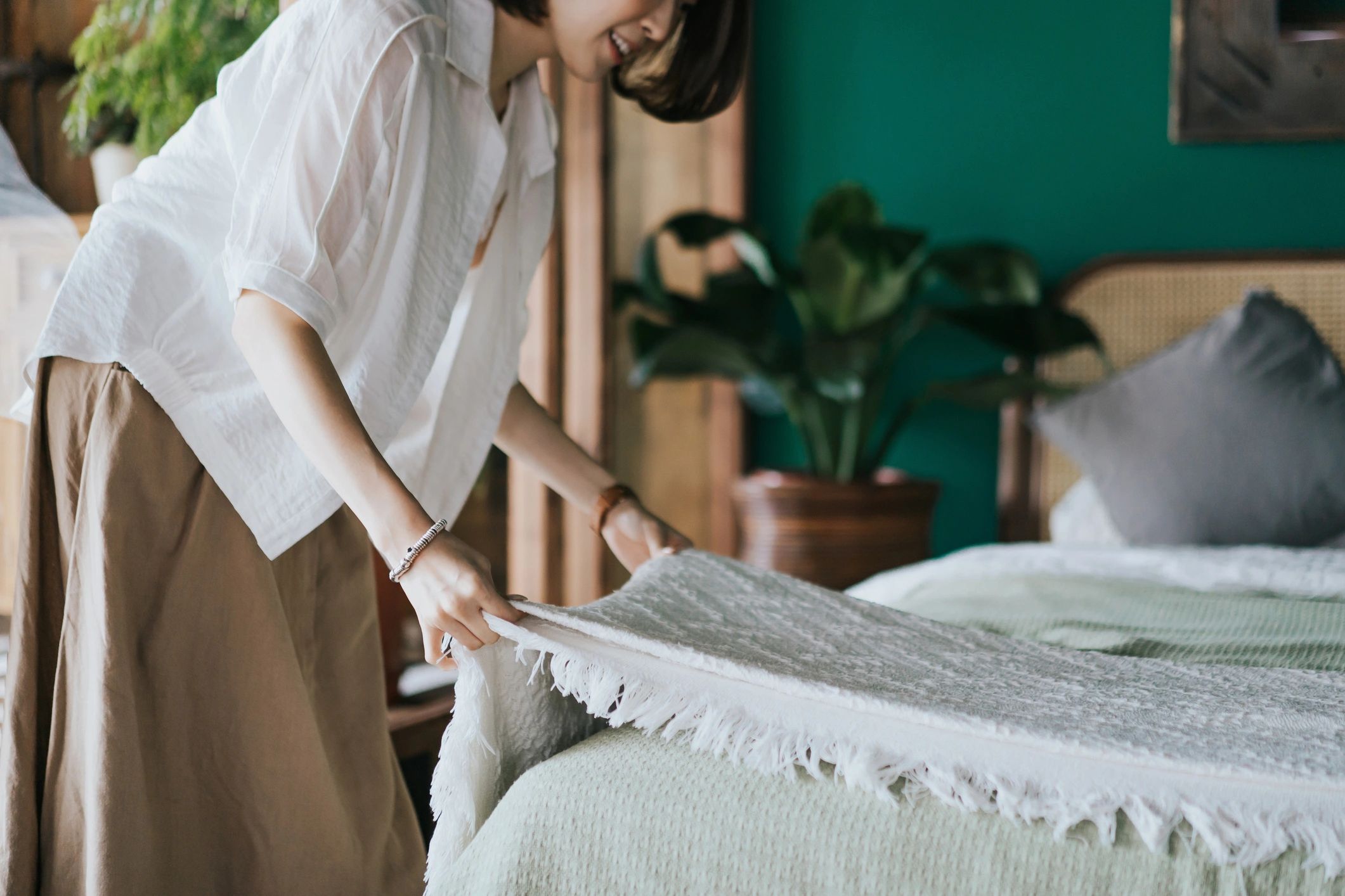 luxury linens folded on bed mountain cabin